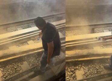 VIDEO: Con botella de agua apagan conato de incendio en vías de Línea 3 del Metro