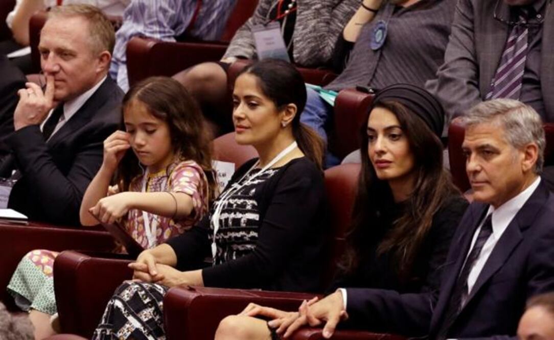 Hayek was accompanied by her family and Clooney by his wife Amal. (Photo: AP)