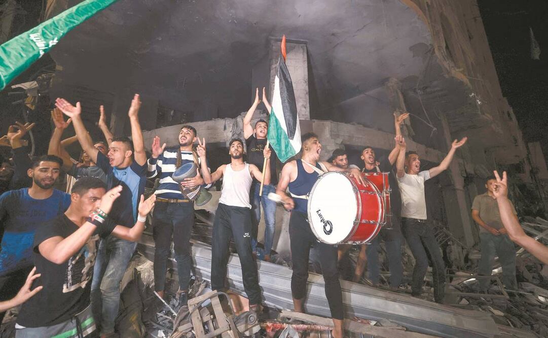 Palestinos celebraron el cese el fuego alcanzado horas antes entre Hamas, la Yihad Islámica e Israel. Foto: Mahmud Hams/ AFP.