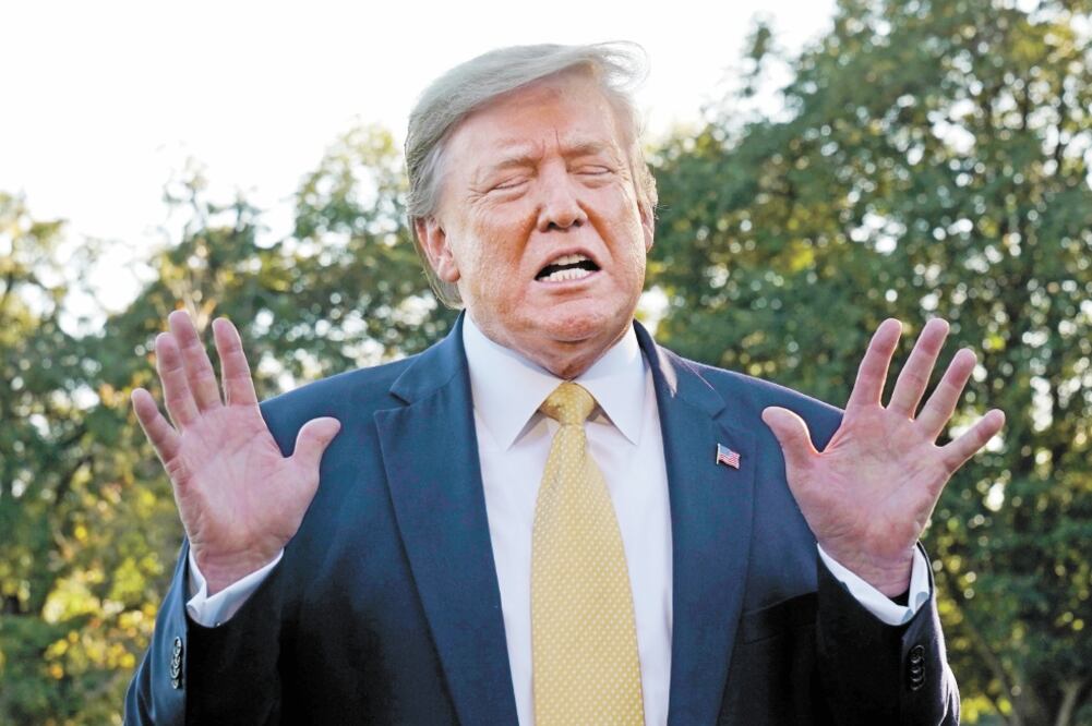 El presidente Donald Trump describió el pacto como la primera fase de un proceso para resolver la guerra comercial con China. Foto: YURI GRIPAS. REUTERS