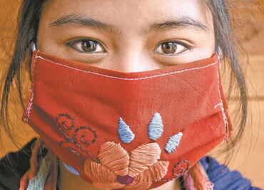 Mexican artisans make hand embroidered face masks for the COVID-19 pandemic