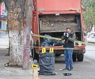 Hallan cadáver de mujer dentro de una maleta en Tlalnepantla