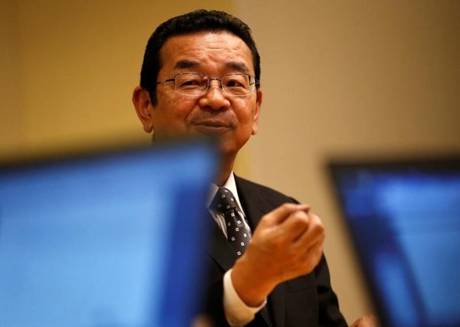 Honda Motor Co. President and CEO Takahiro Hachigo is seen through screens of laptop computers as he speaks during a round-table meeting at the company headquarters in Tokyo, Japan November 21, 2016. REUTERS/Issei Kato
