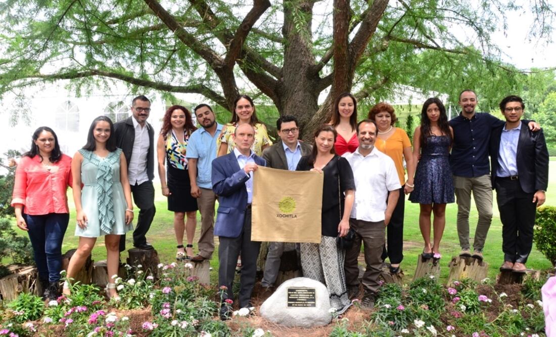 Members of Mexican Center for Environmental Law (CEMDA) pose in front of the Mexican cypress tree named after their organization - Photo: Courtesy of Xochitla Foundation