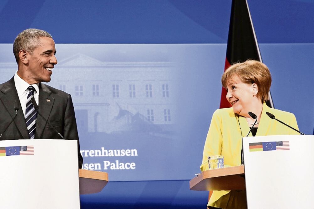 El presidente de EU, Barack Obama, y la canciller alemana, Angela Merkel, durante la conferencia que dieron ayer en Hannover, Alemania (KEVIN LAMARQUE. REUTERS)