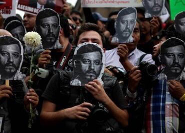 Third man arrested in slaying of journalist and 4 women