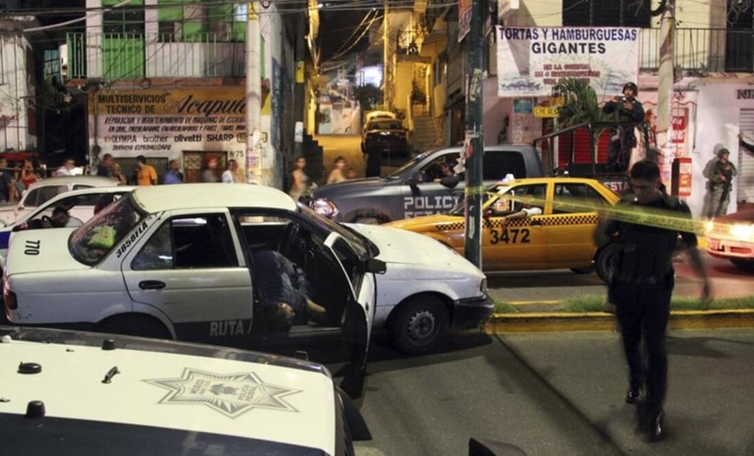 At least five people were killed over the New Year's weekend in the Mexican resort city of Acapulco, including three men found decapitated in a central neighborhood. (AP Photo/Bernandino Hernandez)