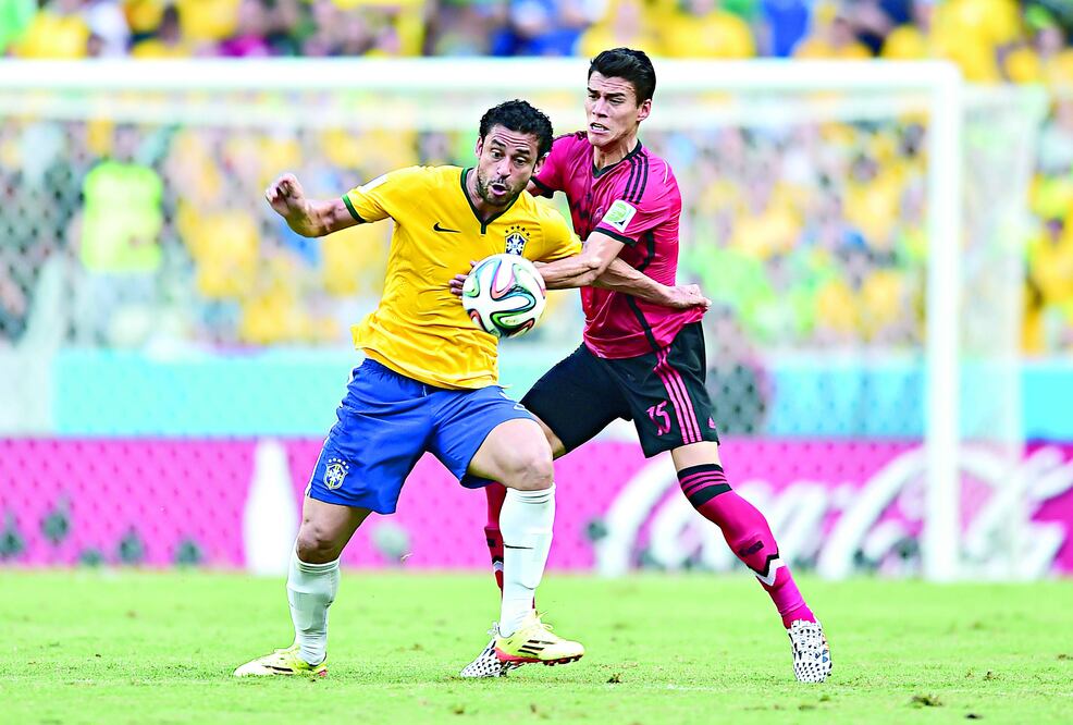 Chaves (izq.) y Moreno en el Castelao el 17 de junio de 2014 (ARCHIVO EL UNIVERSAL)