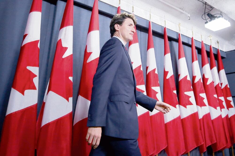 Justin Trudeau, primer ministro de Canadá, en su conferencia en Ottawa. El canadiense conversó vía telefónica con el presidente Enrique Peña Nieto. Foto: CHRIS WATTIE. REUTERS