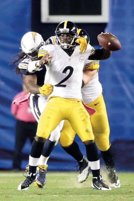 Vick pasó para 203 yardas con un envío de anotación y una intercepción (LENNY IGNELZI. AP)