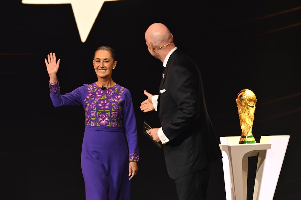 FIFA President Gianni Infantino greetsMexican President Claudia Sheinbaum on stage at the draw for the 2026 soccer World Cup at the Kennedy Center in Washington, Friday, Dec. 5, 2025. (Mandel Ngan/Pool Photo via AP)