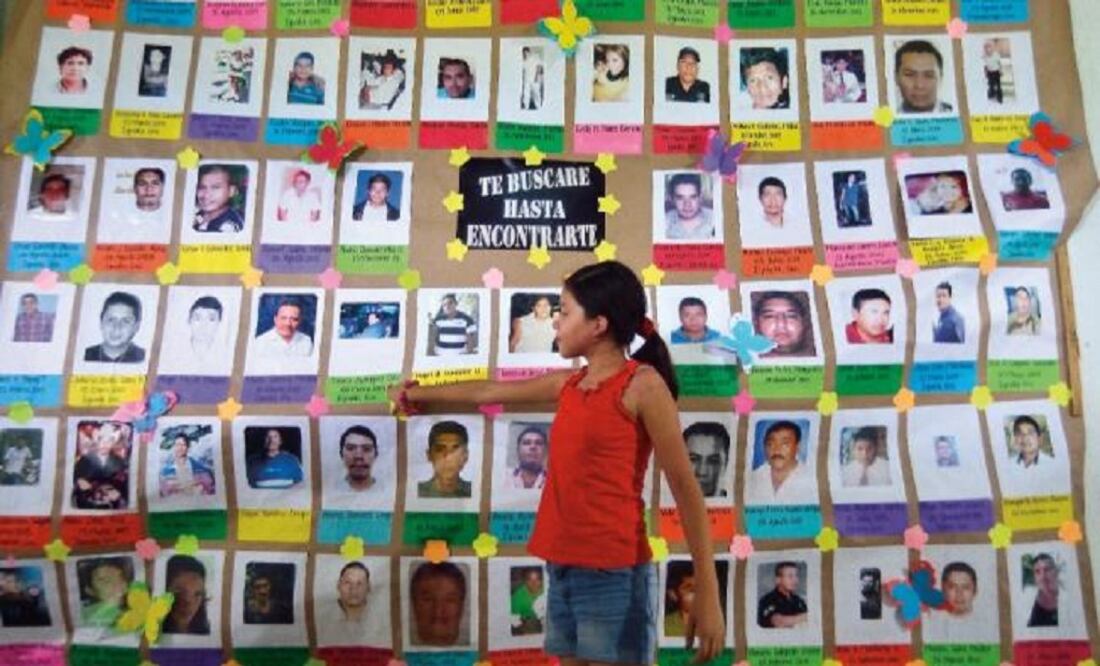 Photos of missing people are included in a mural at Huitzuco's church. (Photo: Salvador Cisneros / EL UNIVERSAL)