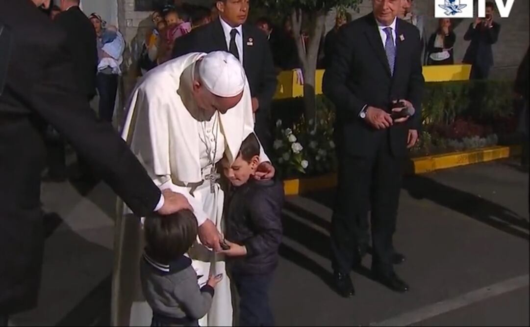 Some kids broke security and embraced the Pope. (Photo: SPECIAL)