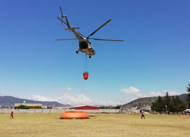 Autoridades federales y de Puebla combaten incendio forestal en Zautla