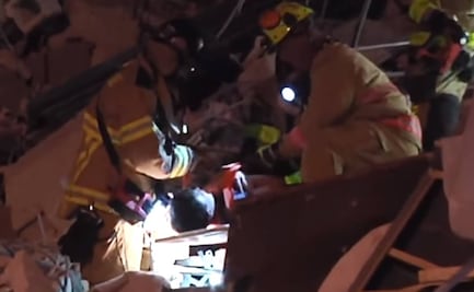 Captan en video rescate de niño atrapado entre escombros de edificio colapsado en Miami