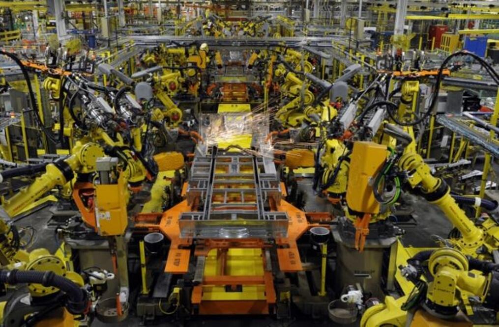 Robotic arms spot welds on the chassis of a Ford Transit Van under assembly at the Ford Claycomo Assembly Plant in Claycomo, Missouri April 30, 2014. (REUTERS/Dave Kaup)