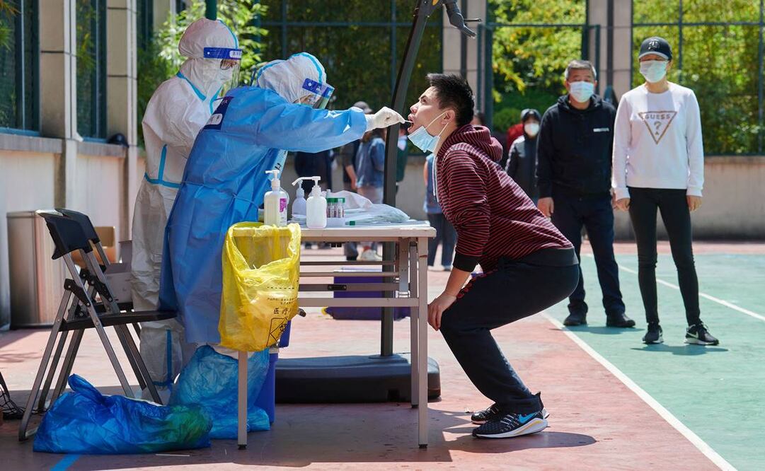 Pruebas Covis-19 en China. Foto: LIU JIN / AFP