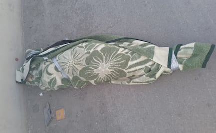 Hallan cadáver de una mujer envuelto en una cobija en carretera rumbo al AIFA