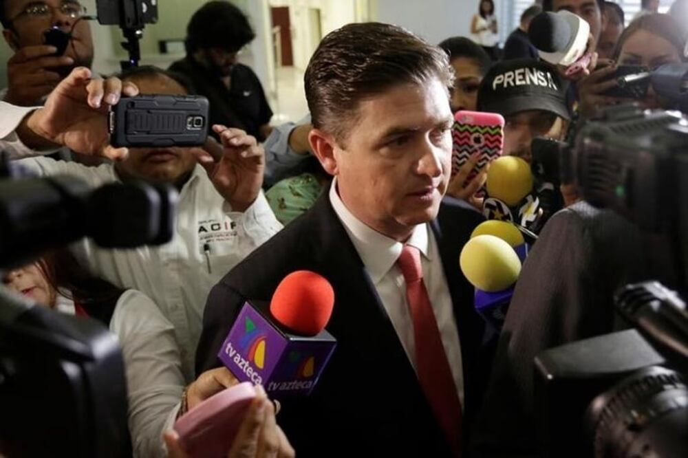 Rodrigo Medina, former governor of Nuevo Leon, talks to the media upon his arrival to a court to declare on tax incentives his administration gave to South Korean carmaker KIA to build a plant, in Monterrey, Mexico, Aug. 8, 2016. REUTERS/Daniel Becerril