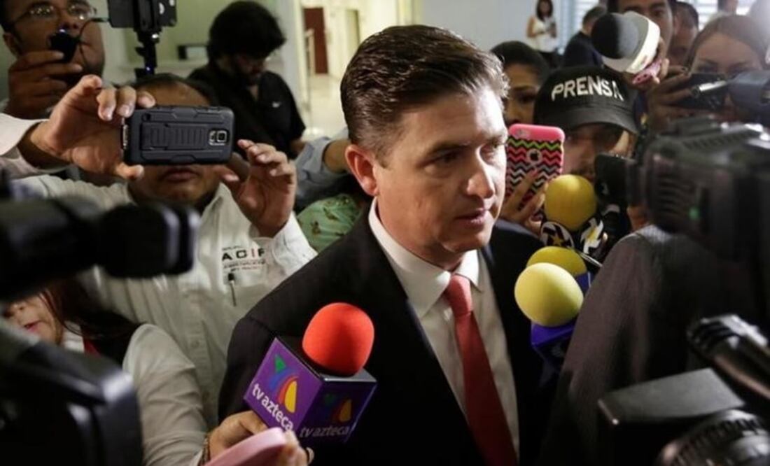 Rodrigo Medina, former governor of Nuevo Leon, talks to the media upon his arrival to a court to declare on tax incentives his administration gave to South Korean carmaker KIA to build a plant, in Monterrey, Mexico, Aug. 8, 2016. REUTERS/Daniel Becerril