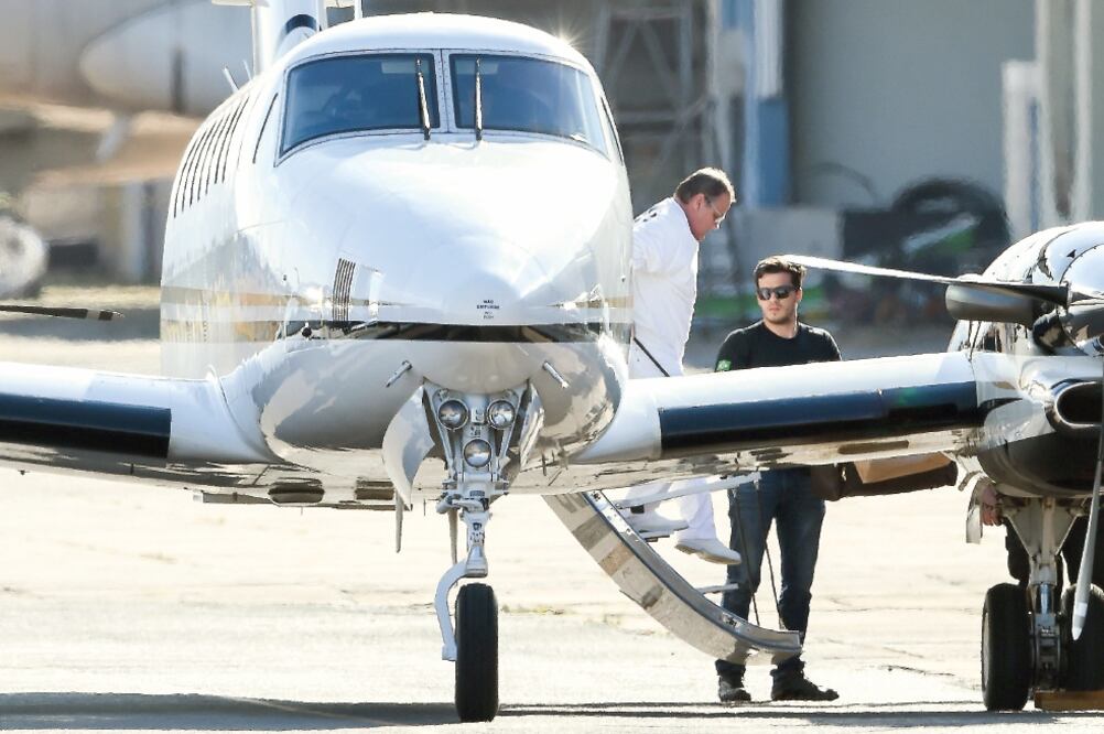 Arresto. Geddel Vieira Lima, ex ministro de Michel Temer, arribó ayer a Brasilia custodiado por la policía. (SERGIO LIMA. AFP)
