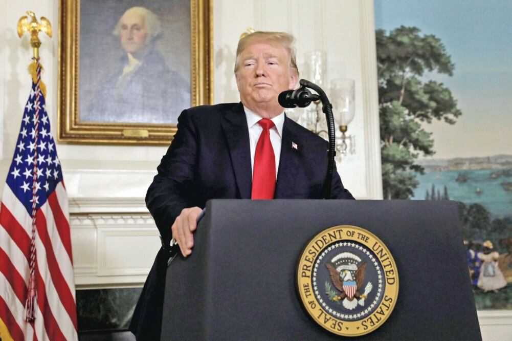 El presidente Donald Trump ofreció el sábado ampliar las protecciones migratorias temporales a cambio de los fondos para el muro (YURI GRIPAS. REUTERS)