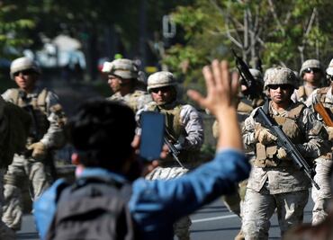 Chile suspends planned fare hike amid violent protests