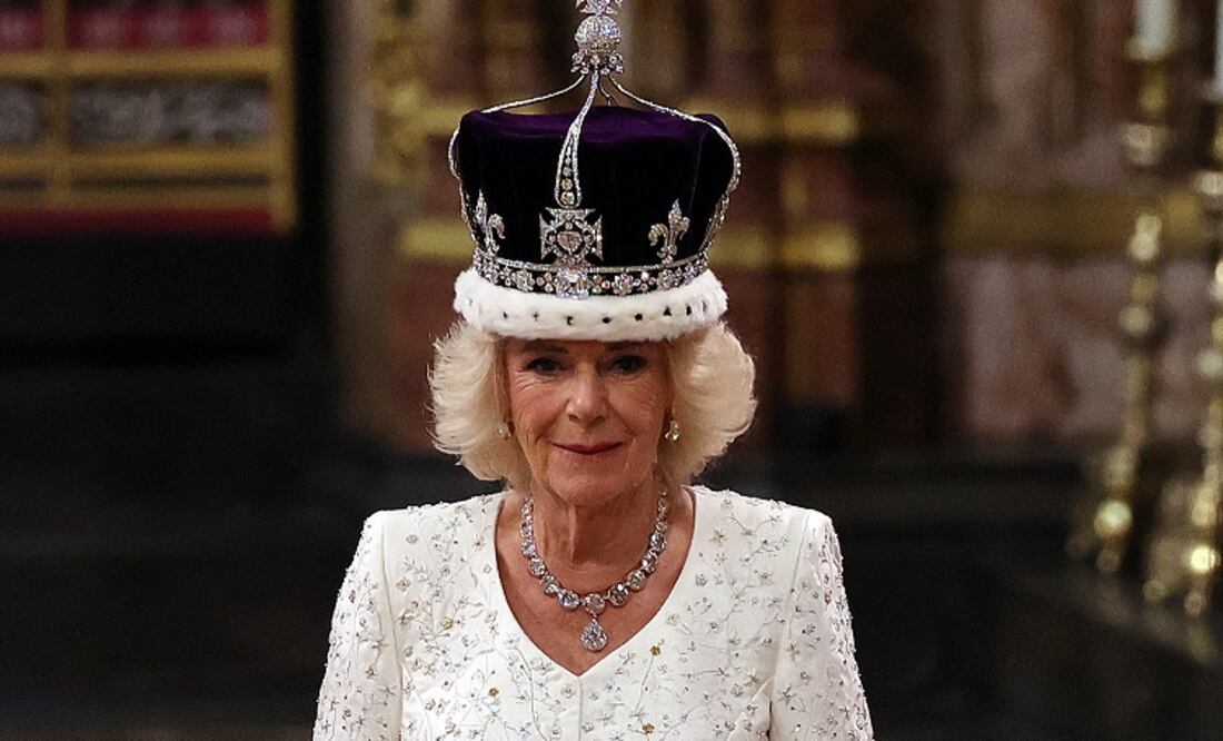 TOPSHOT - Britain's Camilla walks wearing a modified version of Queen Mary's Crown during the Coronation Ceremony inside Westminster Abbey in central London, on May 6, 2023.. - The set-piece coronation is the first in Britain in 70 years, and only the second in history to be televised. Charles will be the 40th reigning monarch to be crowned at the central London church since King William I in 1066. Outside the UK, he is also king of 14 other Commonwealth countries, including Australia, Canada and New Zealand. (Photo by Richard POHLE / POOL / AFP)