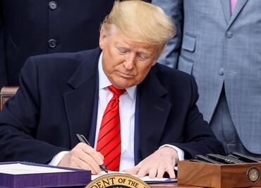 President Donald Trump signs USMCA trade deal