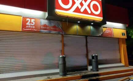 Civiles armados incendian 2 tiendas de conveniencia en Apatzingán