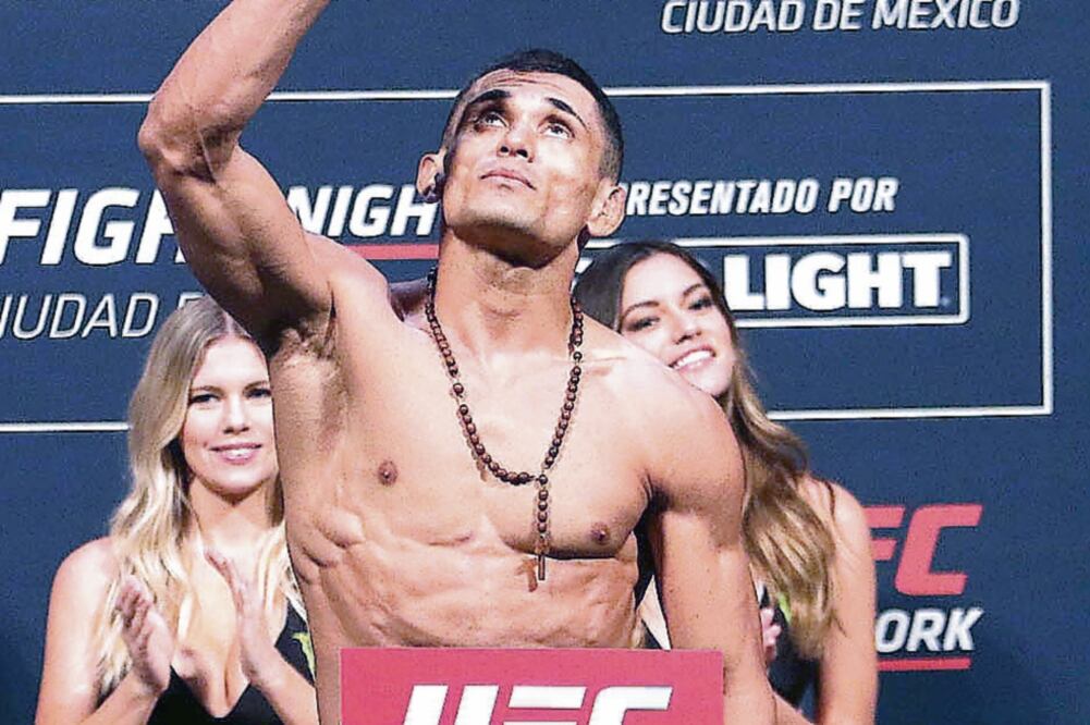 Rafael Dos Anjos marcó 156 libras, dos más que su rival (IMAGO7)