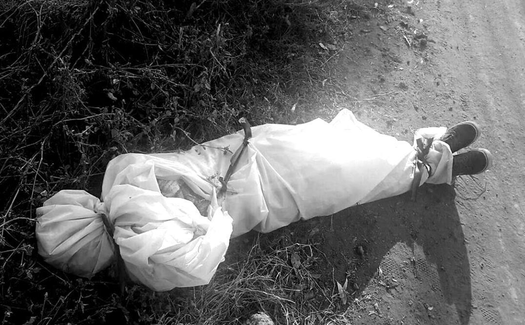 Autoridades policiales indicaron que el cuerpo sin vida y con lesiones producidas por proyectil de arma de fuego se encontraban en un camino de terracería. Foto: Especial