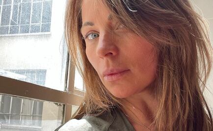 Ludwika Paleta luce las uñas acrílicas cortas y oscura ideales para la oficina