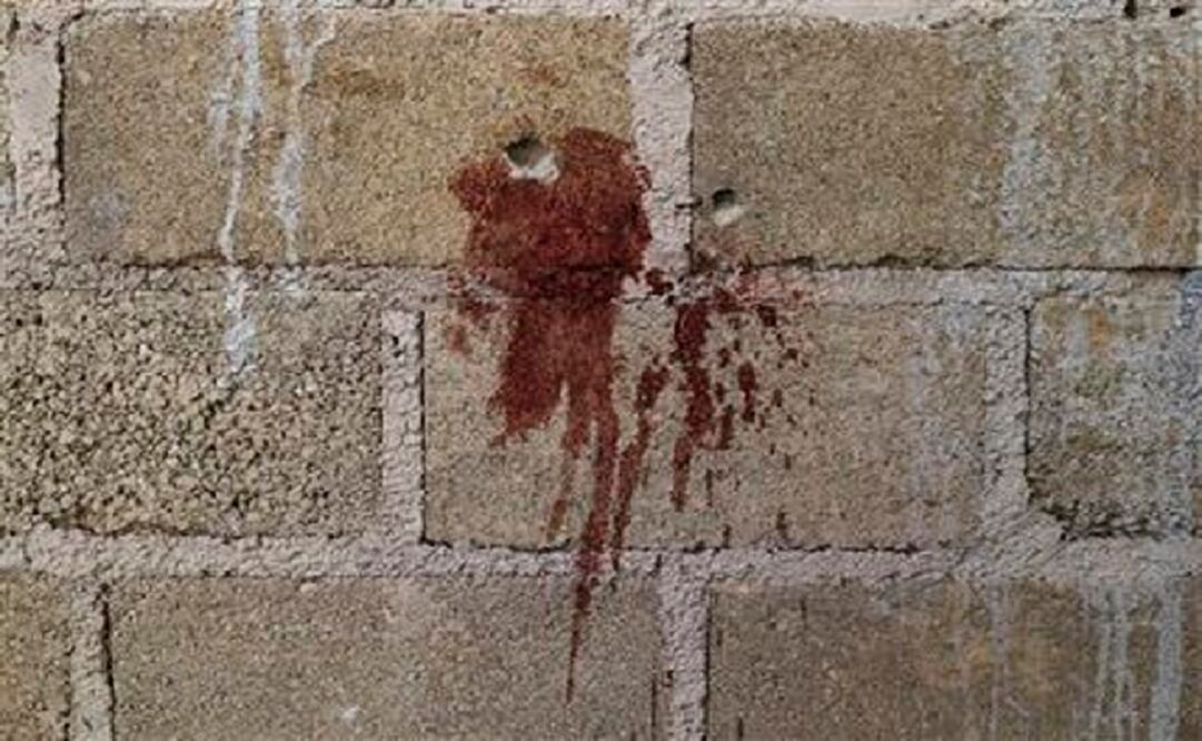 Blood splattered on a wall of the warehouse where the victims of Tlatlaya were killed. (Photo: AP)