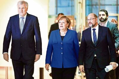 Merkel logra preacuerdo para coalición