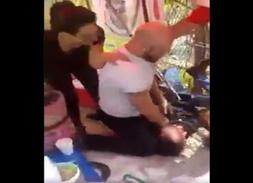 Detienen a pareja que golpeó a vendedor de nieves en Satélite