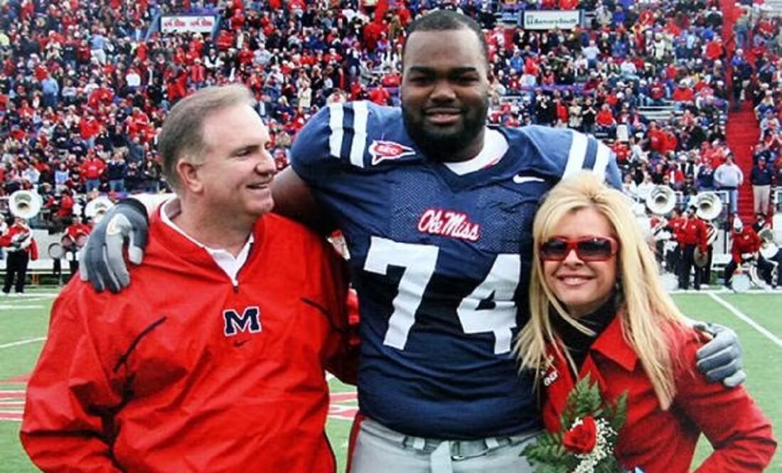 El verdadero Michael Oher junto a los reales Sean y Leigh Anne Tuohy. FOTO: EFE
