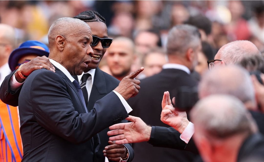 El actor estadounidense Denzel Washington también está dando de qué hablar tras discutir con un fotógrafo junto al cantante y actor estadounidense ASAP Rocky a su llegada a la proyección de la película "Highest 2 Lowest". Foto: AFP.