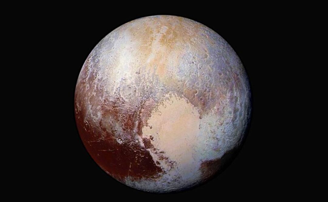 Fotografía obtenida en julio de 2015 por la sonda espacial New Horizons en la que se aprecian dunas y otras formaciones (AP)