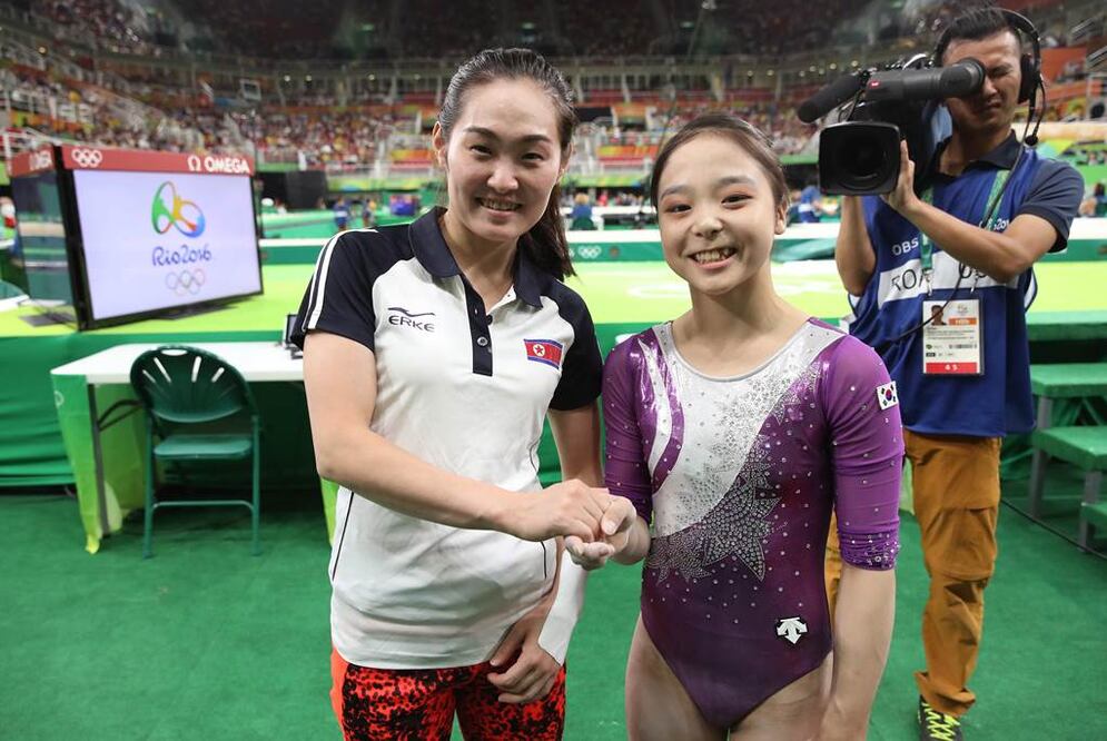 South Korean gymnast Lee Eun-ju, right, and her North Korean counterpart Hong Un Jong