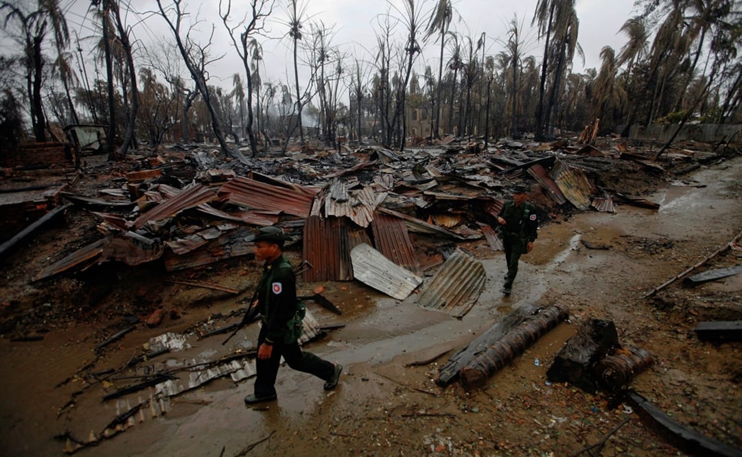Soldiers patrol through a neighbourhood that was burnt during recent violence in Sittwe - Photo: Soe Zeya Tun/REUTERS