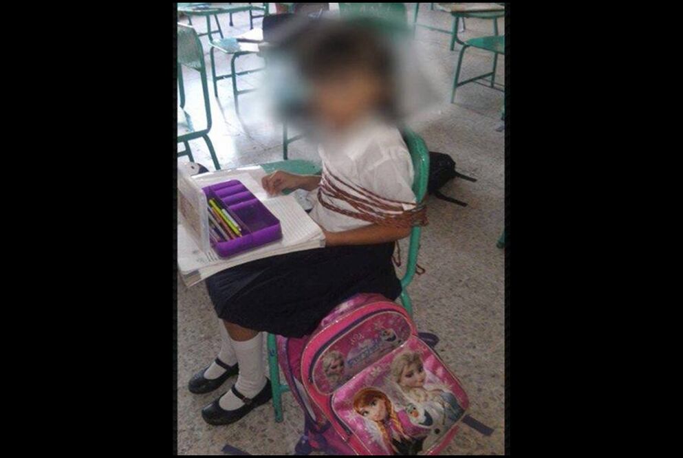 Investigan caso de niña amarrada a su pupitre en Veracruz