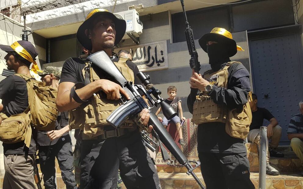 Combatientes palestinos de Fatah de las Brigadas de los Mártires de Al-Aqsa, hacen guardia. Foto: AP