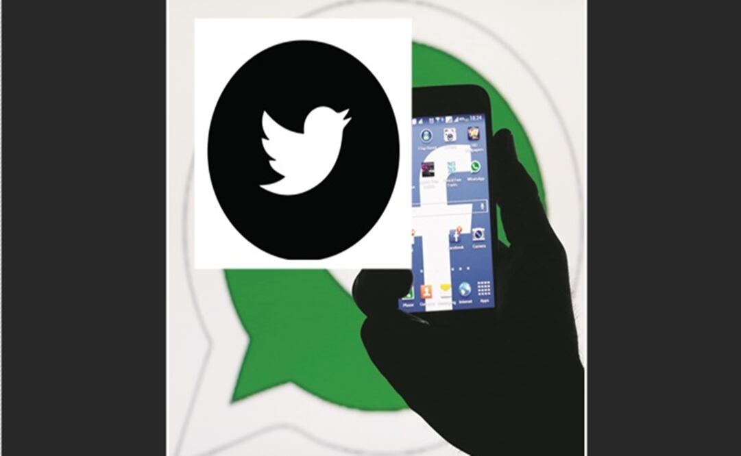 A man holding a smart phone with a Facebook logo as its screen wallpaper in front of a WhatsApp messenger logo - Photo: Dado Ruvic/REUTERS