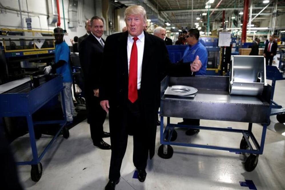 U.S. President-elect Donald Trump speaks to members of the news media as he tours a Carrier factory in Indianapolis, Indiana, U.S., December 1, 2016. REUTERS/Mike Segar