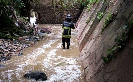Hallan cuerpo de mujer arrastrada por corriente de río tras tormenta en Naucalpan 