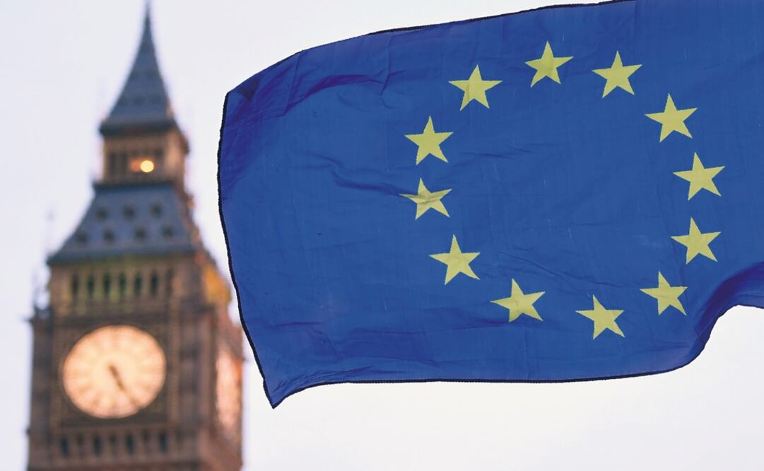 A European Union flag is held in front of the Big Ben clock tower in Parliament Square - Photo: Justin Tallis/REUTERS