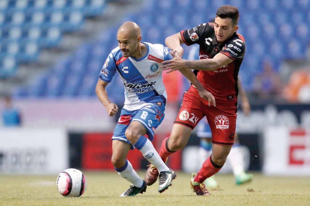 Los poblanos sumaron un punto que poco les sirve en la porcentual (HUGO ORTUÑO. EFE)