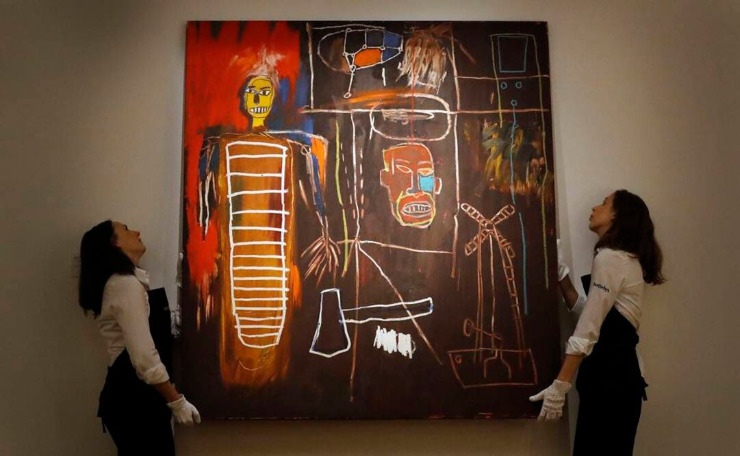 El lote más caro, el cuadro Air Power de Basquiat, alcanzó los 7.1 millones de libras (8.8 millones de dólares). FOTO: AP.