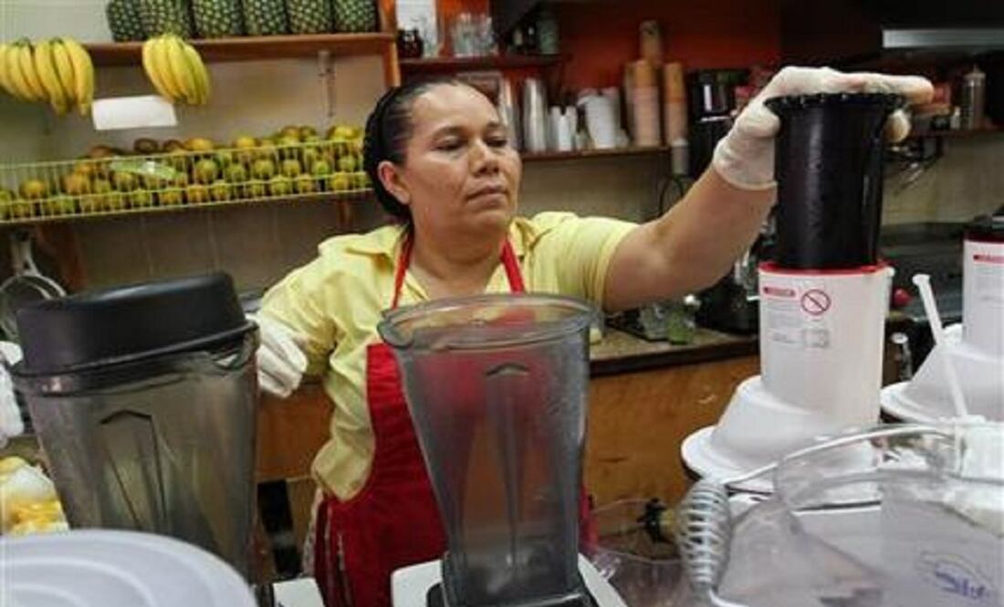 Celina Álvarez, 51, works at Juguería de regreso al Edén, her shop in the Queens borough of New York. (Photo: AP)